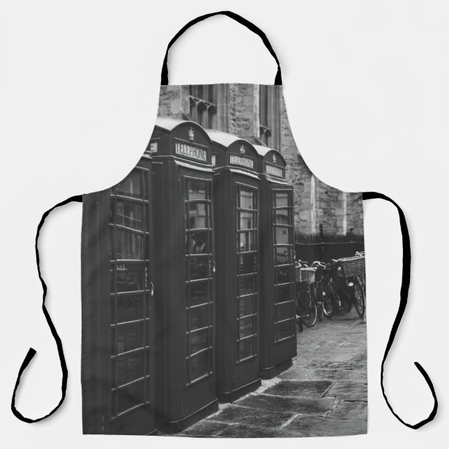 GRAYSCALE PHOTO OF FOUR TELEPHONE BOOTHS LINED UP APRON (Front)