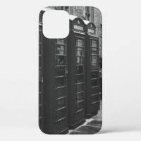GRAYSCALE PHOTO OF FOUR TELEPHONE BOOTHS LINED UP