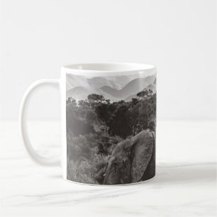 GRAYSCALE PHOTO OF GRAY ELEPHANT NEAR TREES COFFEE MUG