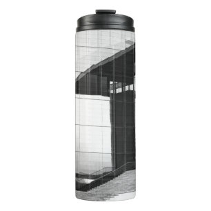 GRAYSCALE PHOTO OF MAN WALKING ON CONCRETE PAVEMEN THERMAL TUMBLER