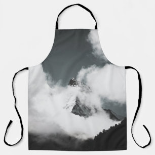 GRAYSCALE PHOTO OF MOUNTAIN COVERED IN CLOUDS APRON