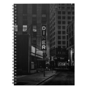 GRAYSCALE PHOTO OF PEARL DINER SIGN IN CITY NOTEBOOK