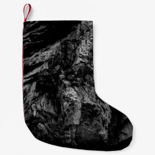Grayscale photo of rock small christmas stocking