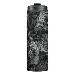 Grayscale photo of rock thermal tumbler
