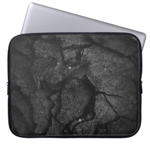 Grayscale photography of rock formation laptop sleeve