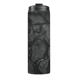 Grayscale photography of rock formation thermal tumbler