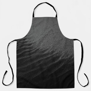 GRAYSCALE PHOTOGRAPHY OF SAND APRON