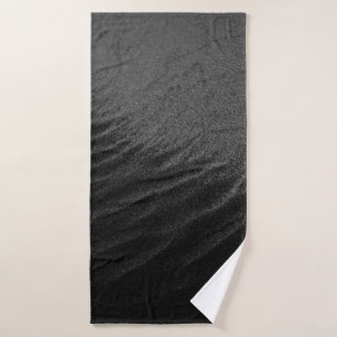 GRAYSCALE PHOTOGRAPHY OF SAND BATH TOWEL
