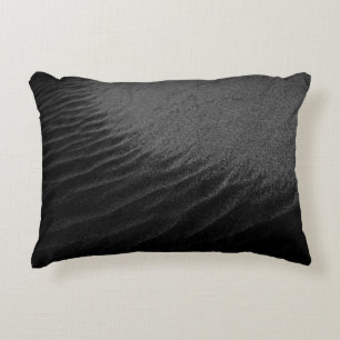 Grayscale photography of sand decorative cushion
