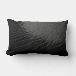 Grayscale photography of sand lumbar cushion