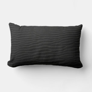 Grayscale photography of sand lumbar cushion
