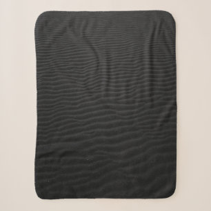 Grayscale photography of sand sherpa blanket