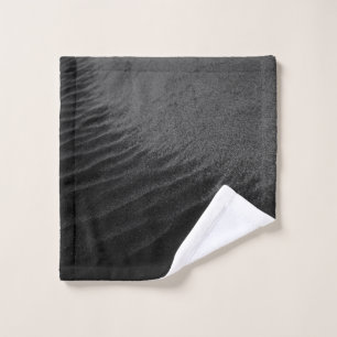 Grayscale photography of sand wash cloth