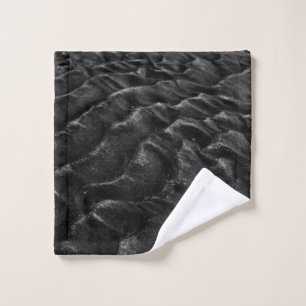 Grayscale photography of sand wash cloth