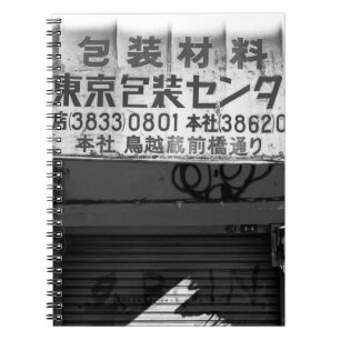 GRAYSCALE PHOTOGRAPHY OF STORE SIGN NOTEBOOK
