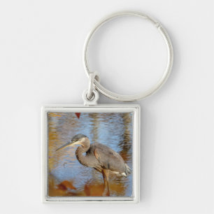 Great Blue Heron framed with fall foliage Key Ring