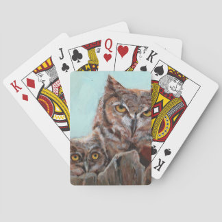 Great horned owl and chick playing cards