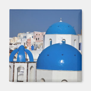 Greece, Santorini. Bell tower and blue domes of Magnet