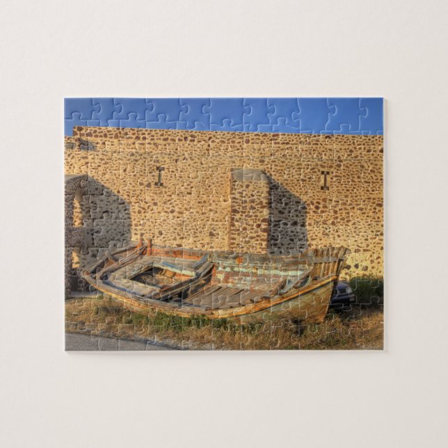 Greece, Santorini, Oia. Old fishing boat on dry Jigsaw Puzzle (Horizontal)