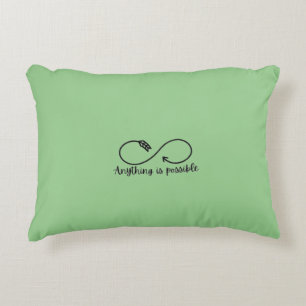 Green accent pillow with positive message