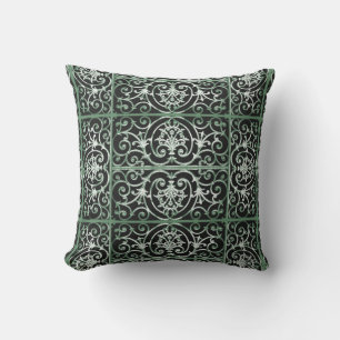 Green and black scrollwork pattern cushion