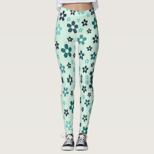 Green and blue flower on light green background leggings
