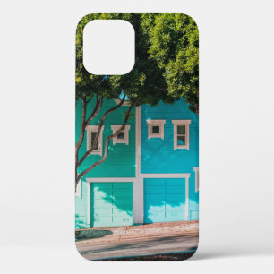Green and blue houses beside trees on sidewalk iPhone 12 case