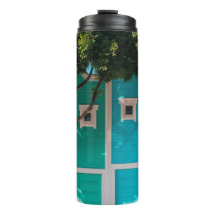 Green and blue houses beside trees on sidewalk thermal tumbler