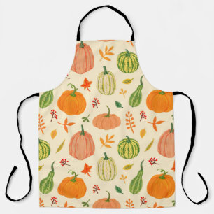 Green and orange pumpkins with leaves and branches apron