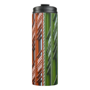 Green and red architectural structure thermal tumbler