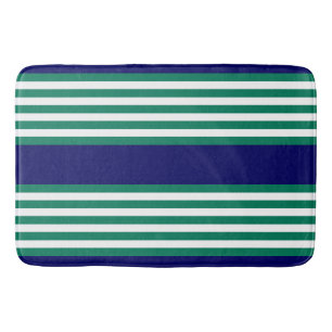 Green and white stripes pattern with navy blue bath mat