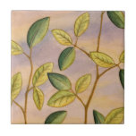 Green and Yellow Leaves on Sunset Background Tile<br><div class="desc">The purple and gold of a sunset background is the perfect contrast to the yellow and green leaves that are the focus of this piece by Megan Meagher. You can almost hear the wind sing as it gently caresses the leaves.</div>