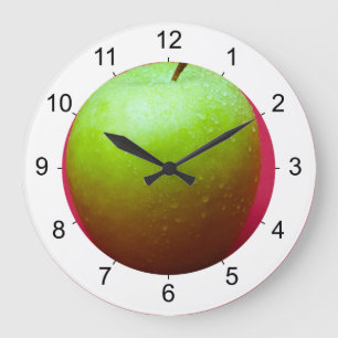 Green apple on red background large clock