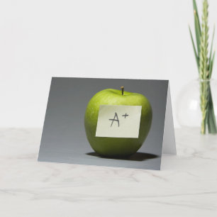 Green apple with adhesive note with letter A and Card