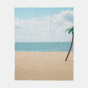 Green artificial palm tree on seashore fleece blanket