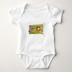 Green asparagus with strawberries top view