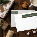 Green Babys First Christmas Return Address Wrap Around Label<br><div class="desc">A simple modern holiday wrap around return address label featuring first christmas in white script typography on a dark green background. Personalise with your babys name. Add this special detail to your holiday mailings.</div>