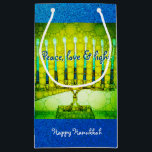 Green Blue Peace Love Light Hanukkah Menorah Bold Small Gift Bag<br><div class="desc">“Peace, love & light.” A close-up photo illustration of a bright, colourful, green and yellow artsy menorah against a blue faux glitter background helps you usher in the holiday of Hanukkah in style. Feel the warmth and joy of the holiday season whenever you use this cute and fun custom small...</div>