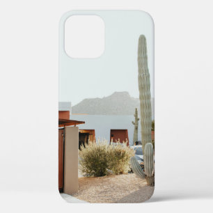 Green cactus beside houses in the morning iPhone 12 case