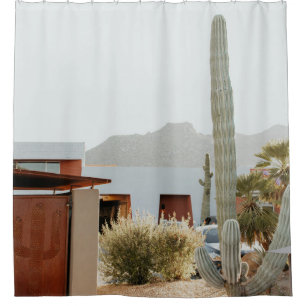 Green cactus beside houses in the morning shower curtain