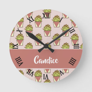 Green cactus plants on pink round clock