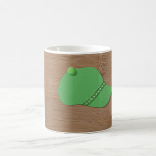 Green cap on a bamboo wood coffee mug