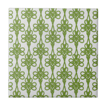 Green Celtic Knot Design on White Ceramic Tile