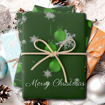 Green Christmas Ornaments Wrapping Paper Sheets<br><div class="desc">Add festive sparkle to your packages with these Green Christmas Ornaments Wrapping Paper Sheets. Featuring elegant Christmas ornaments with ribbon and bows and dangling hanging baubles, the design is accented by delicate white snowflakes for a cheerful holiday theme. The joyful greeting Merry Christmas appears in elegant script, while the simple...</div>