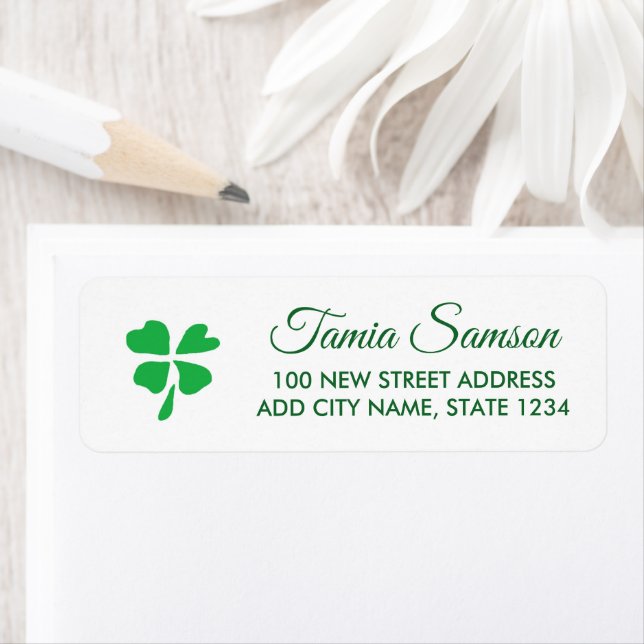 Green clover leaves drawing on white return address label (Insitu)
