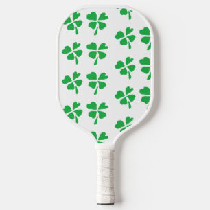 Green clover leaves on white pickleball paddle