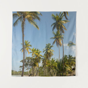 Green coconut palm tree near green grass field in  tapestry