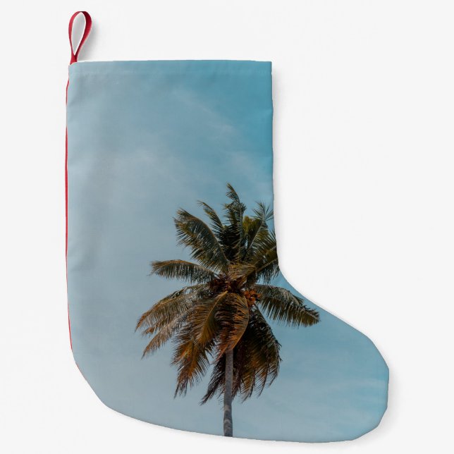 Green coconut tree under blue sky small christmas stocking (Front)