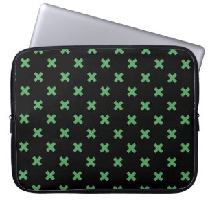 Green cross stitches on black laptop sleeve