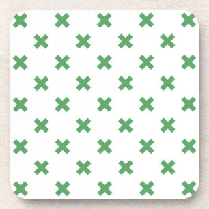 Green cross stitches on white coaster